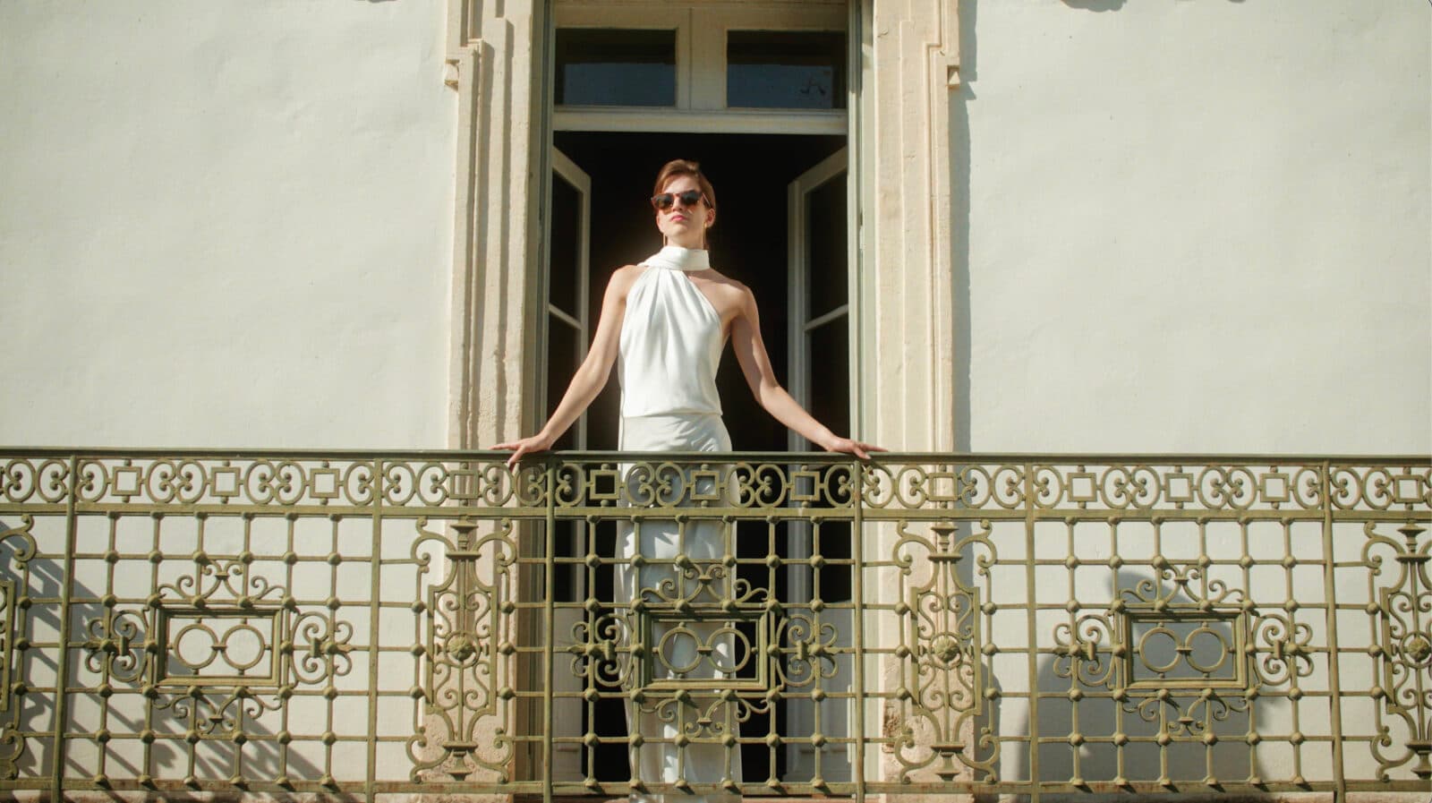 Beautiful bride on chateau balcony